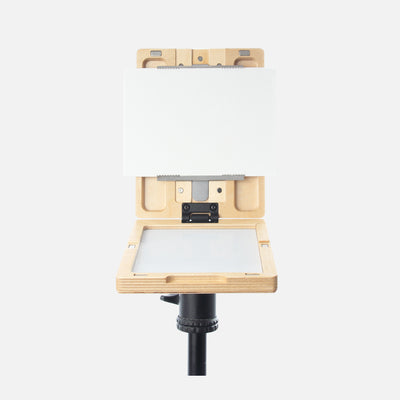 u.go Plein Air Anywhere Pochade Box, 6" x 8" model, on tripod with canvas panel