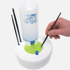 Masterson Rinse Well Fresh Water Brush Cleaner cleaning paint off an artist paint brush