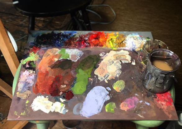 New Wave handcrafted POSH wood table top artist paint palette covered in oil paint in the art studio of Felicia Forte