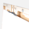u.go Plein Air Anywhere Pochade Box, 11" x 14.5" model, top teeth of panel holder gripping a canvas panel