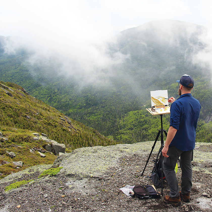 u.go Plein Air Anywhere Pochade Box, 8.4" x 11.25" model, on mountain peak plein air landscape painting